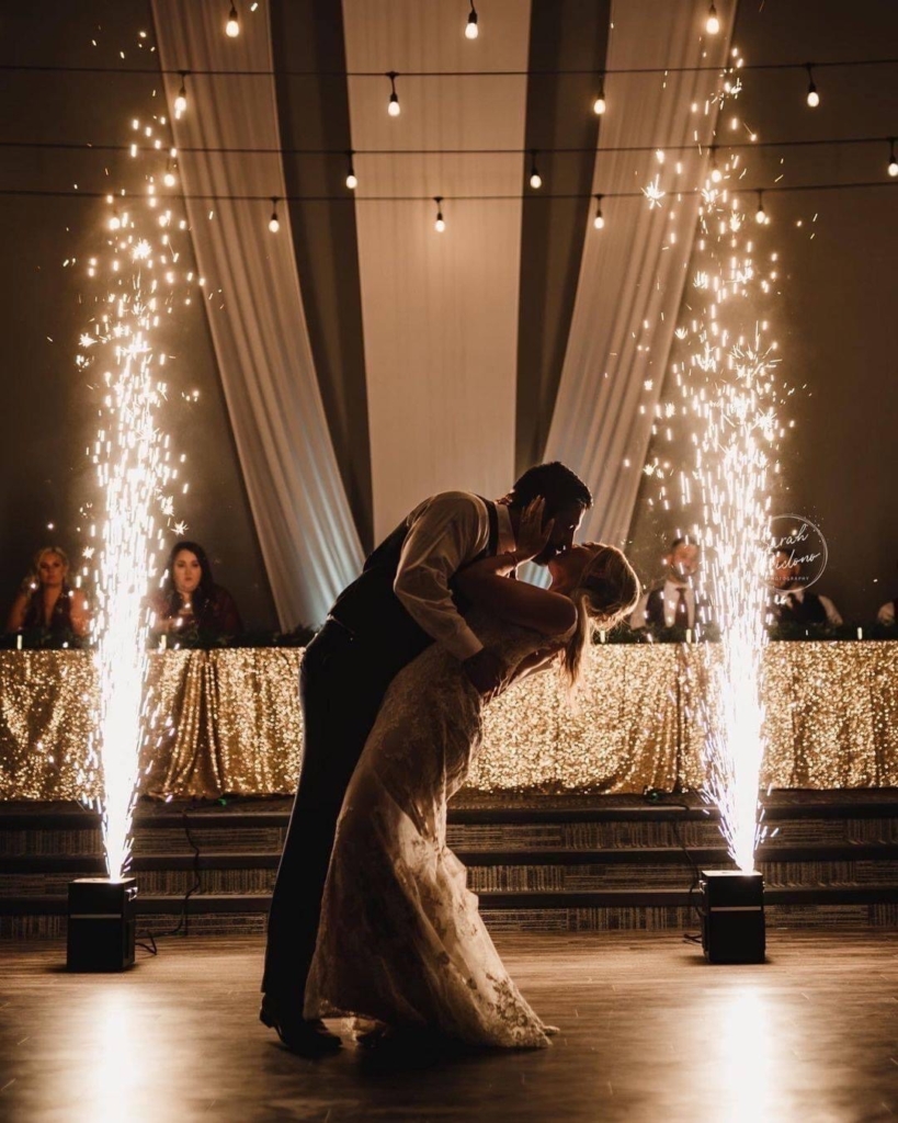 Bride and groom kissing at wedding